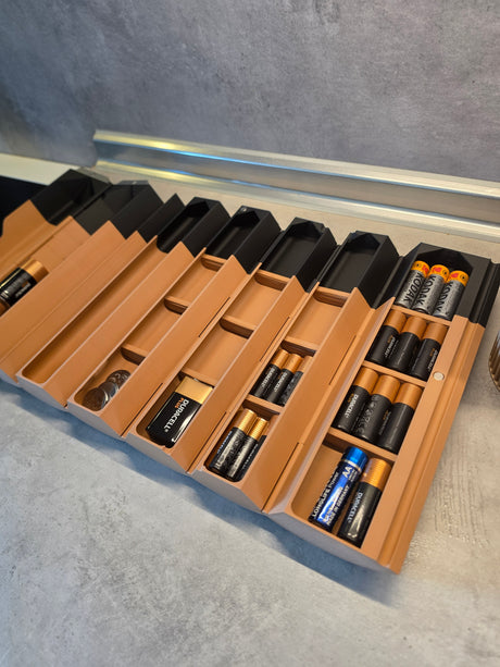 Batteriholder rullet sammen i kompakt format